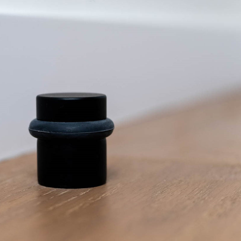 Universal Door Stop - Floor Mount - 1" Brass/Matt Black